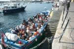 An inter island launch embarking passengers at St Marys Isles of Scilly